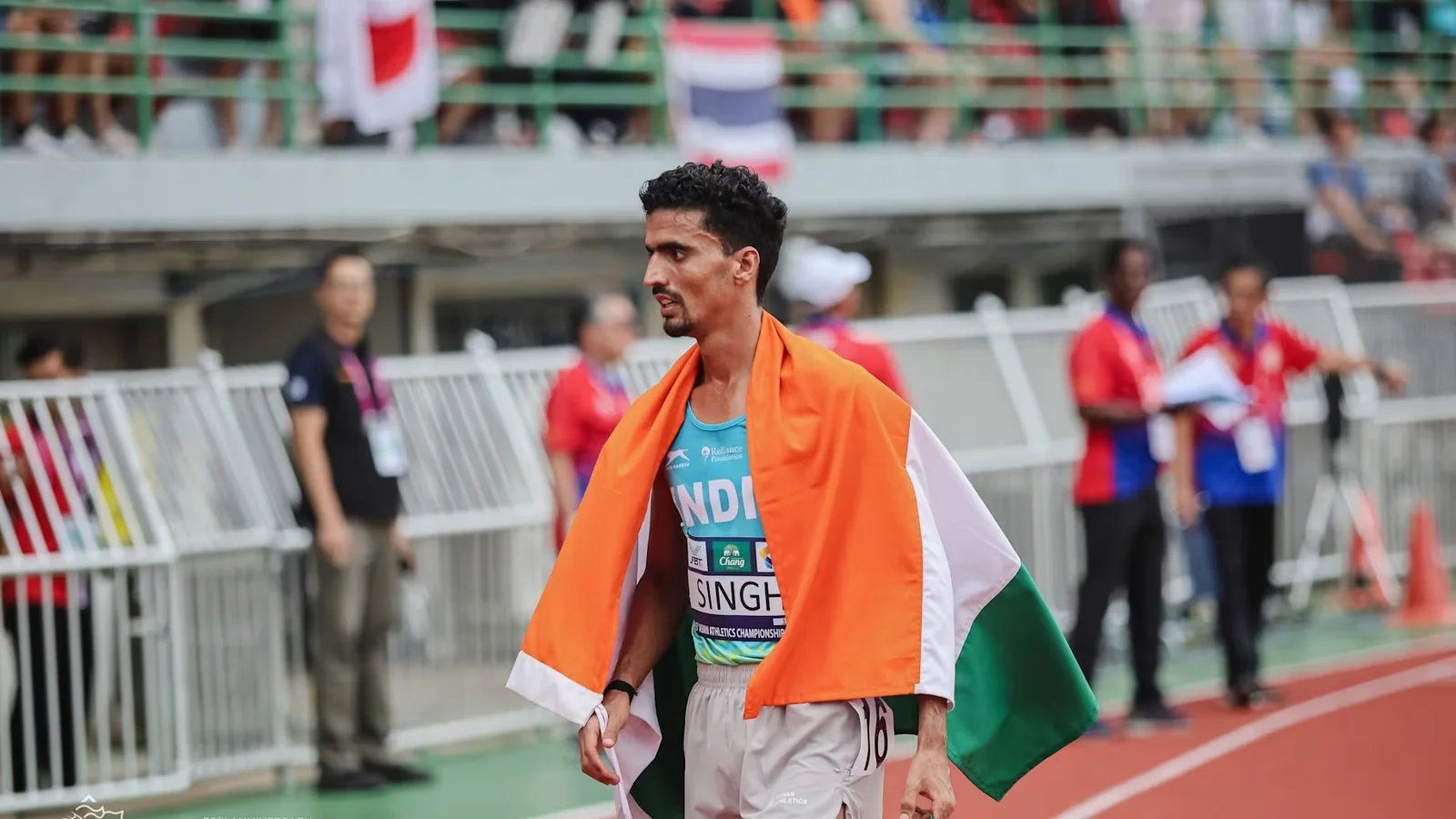 Gulveer Singh crossing the finish line at Kalinga Stadium in Bhubaneswar during the men's 5,000m event on day one of the 65th National Inter-State Senior Athletics Championships 2026