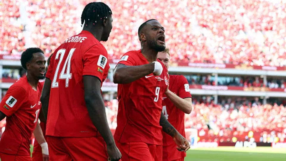 Cyle Larin after scoring the equaliser for Canada